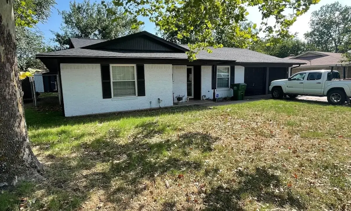 Professional roofing crew working on a residential roof in Tuba City